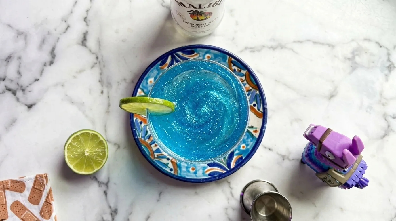 Top-down on the glitter shimmer with a bandage-print napkin at the edge